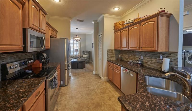 Kitchen with wood cabinets, granite counter tops and high end appliances.