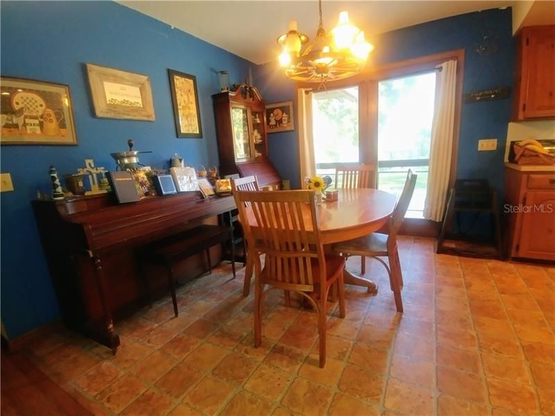 Spacious dining area with french doors to the back patio and back yard