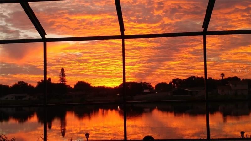 WOW !!! Imagine waking up to the this?  Beautiful sunrise over the lake which can be seen from your bed in the master bedroom