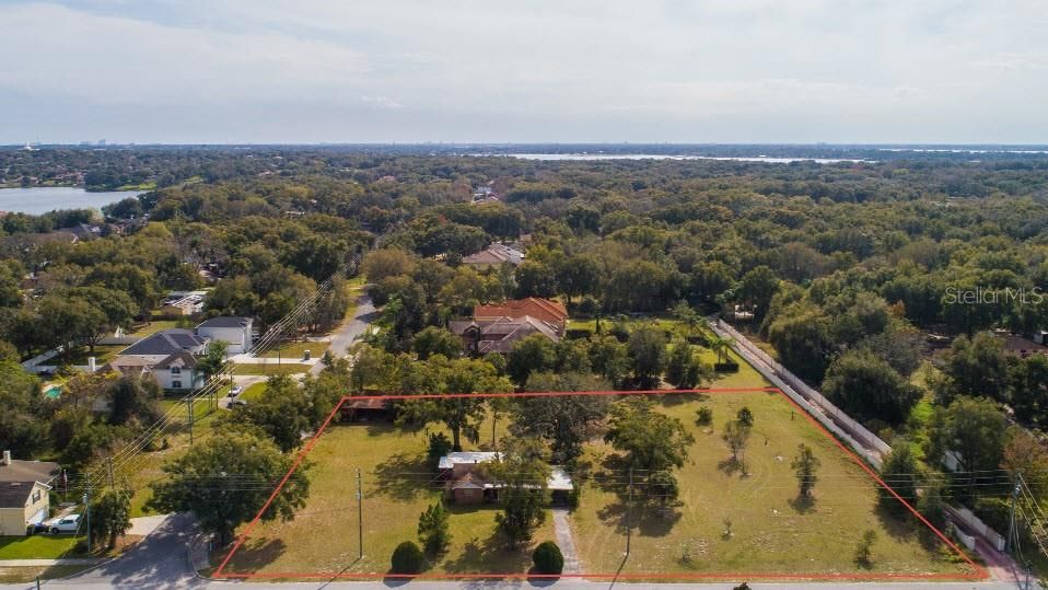 Aerial from front of house, showing south surrounding area and lakes
