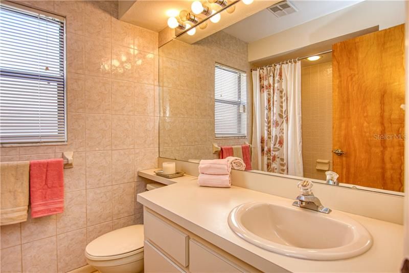 Second full bathroom is large and bright.