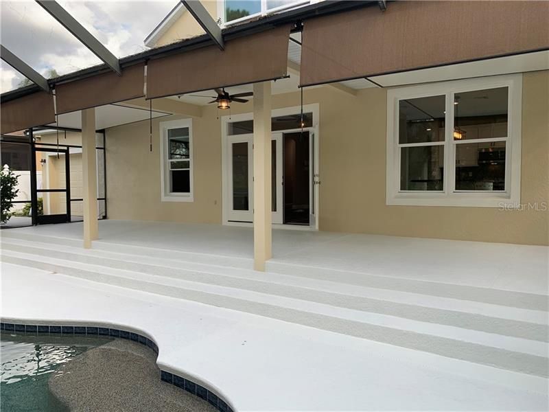 Spacious cover patio for entertaining. Large sun shelf in pool. Fun for the little ones!