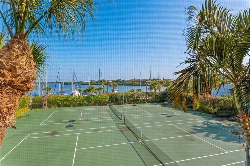 Two tennis courts and the marina beyond.
