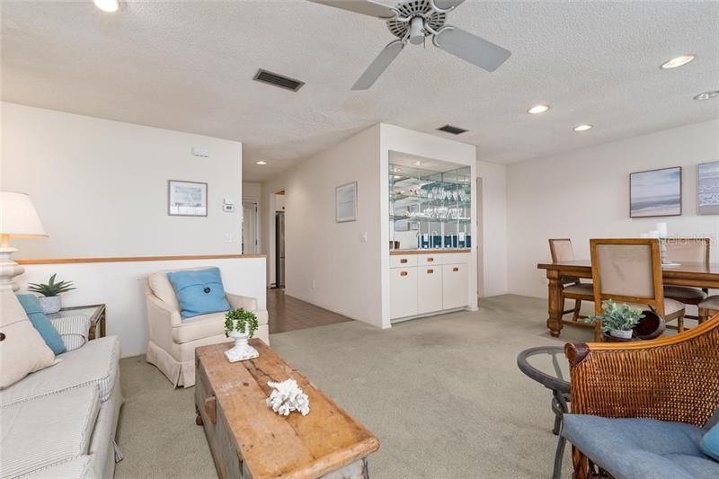 From the lother side of the living area you can enjoy your guests at the dining table and serve your drinks from the wet bar.