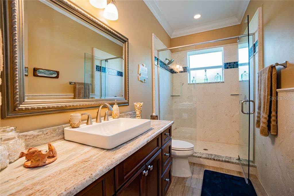 Large guest bathroom with stand up shower.