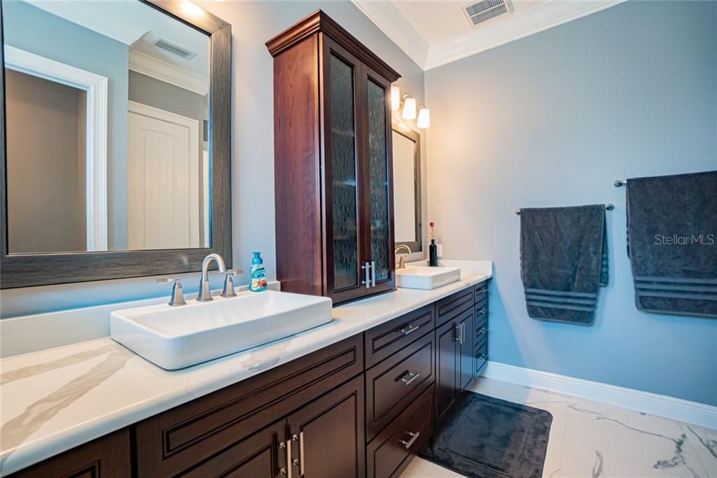 Dual vanities and gorgeous cabinetry.