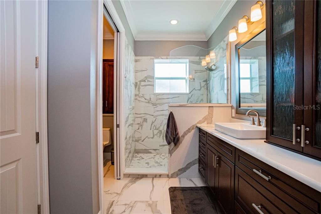Spa-like marble master bathroom.