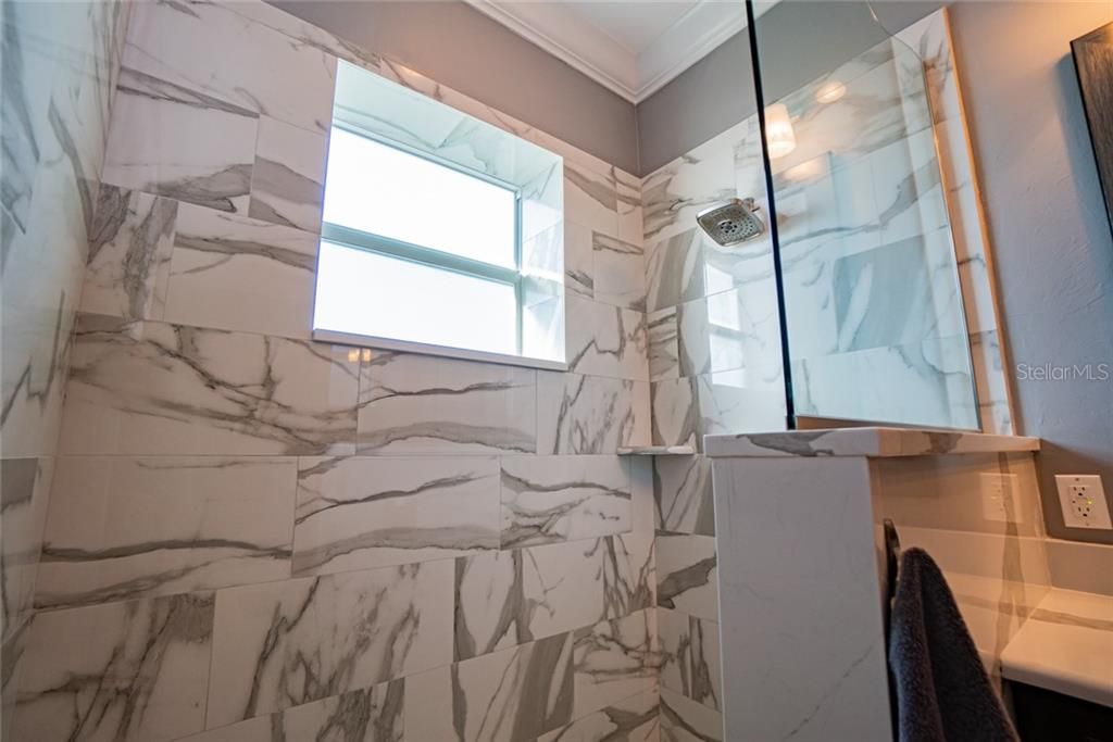 Large, marble roman shower.