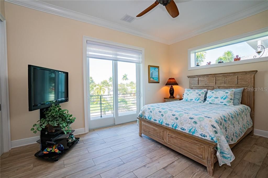 Large guest bedroom with private balcony