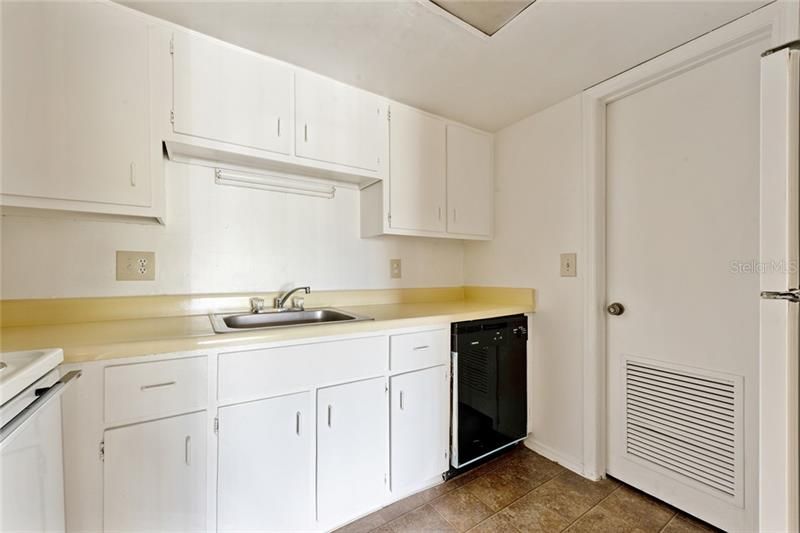 KITCHEN offers ample cabinet and counter space.