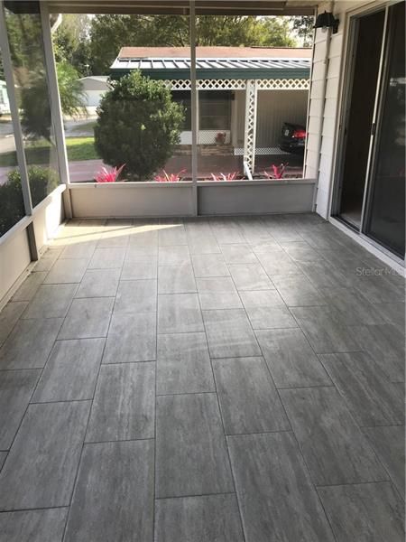 Tiled Porch with sliding glass doors