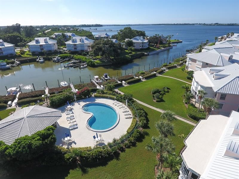 Aerial view overlooking pool, marina & out to the Intracoastal