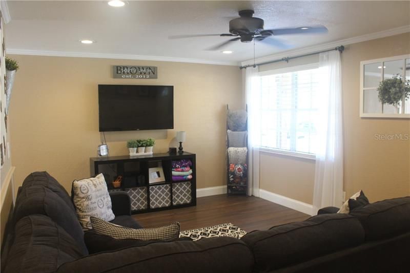 Family Room w/ Natural Light.  Crown Molding.  New Flooring