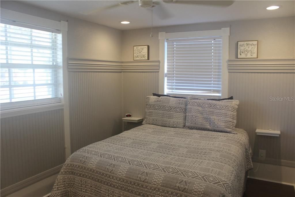 Master Bedroom.  New Flooring.  Bead Board on Walls.  New Lighting. Windows to Front and Side Yard.  Storage Organizer in closet.