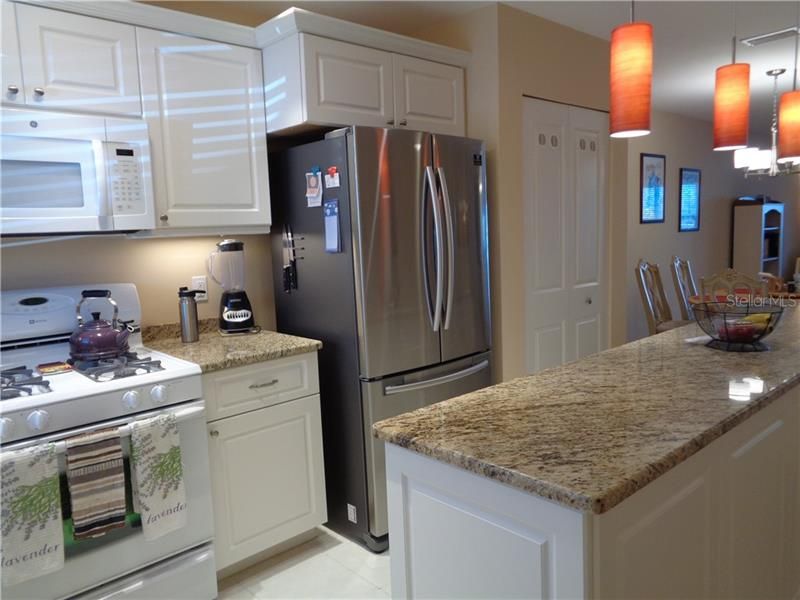 Kitchen is a joy with granite counters and new appliances.