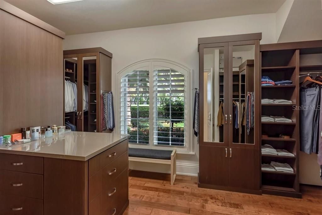 Master Suite: Custom designed twin closets, wood floors, dressing area