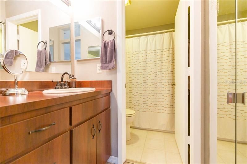 Master bath with linen closet and walk-in shower.