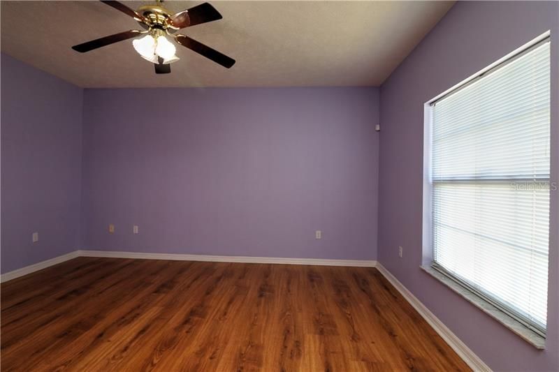 Master bedroom with laminate flooring....