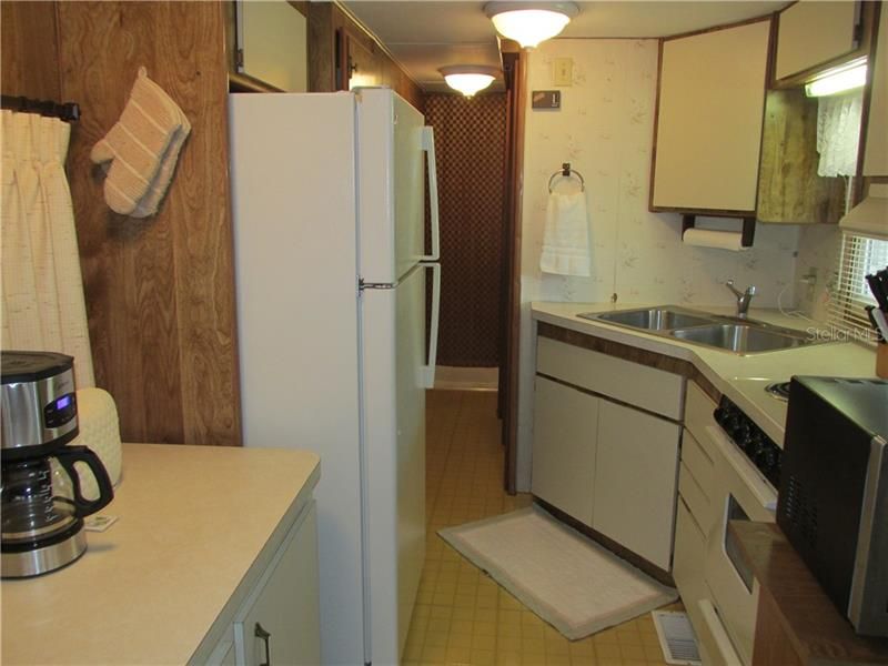 Kitchen includes refrigerator, range, microwave and coffee maker!