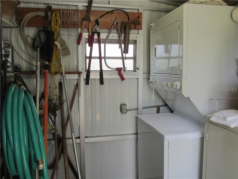 Washer and dryer stack in shed stays for the new owners too!