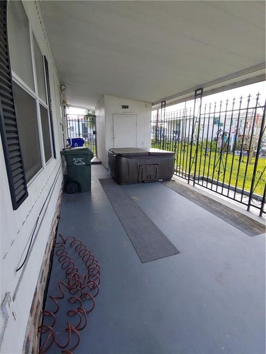 Gated Carport with Hot Tub