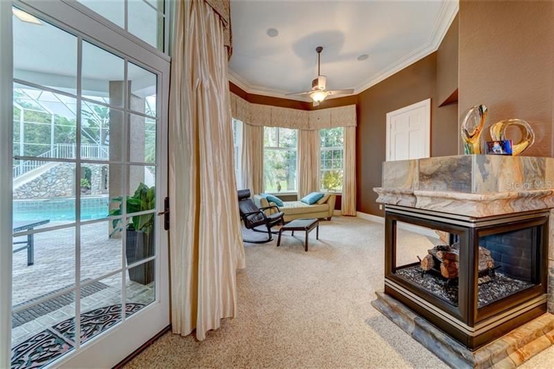 Master bedroom sitting area with gas fireplace