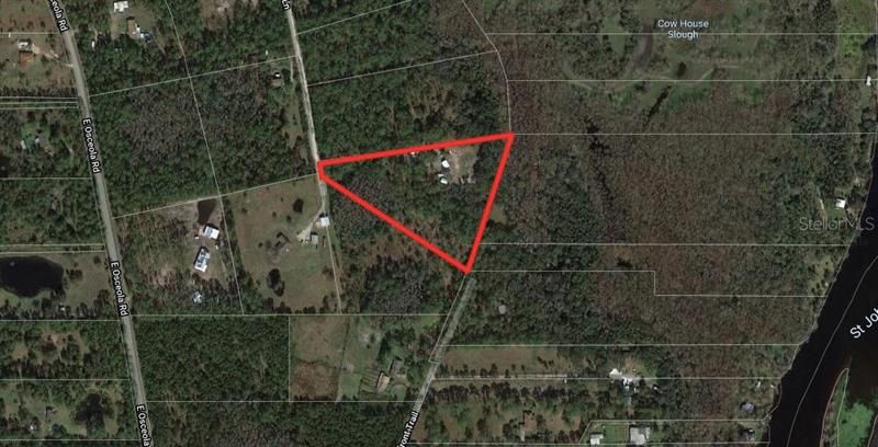 Build your dream home on this High and Dry 5-acre property with access to the St. Johns River