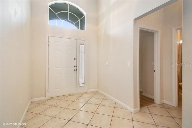 Tiled  bright entry with high ceilings