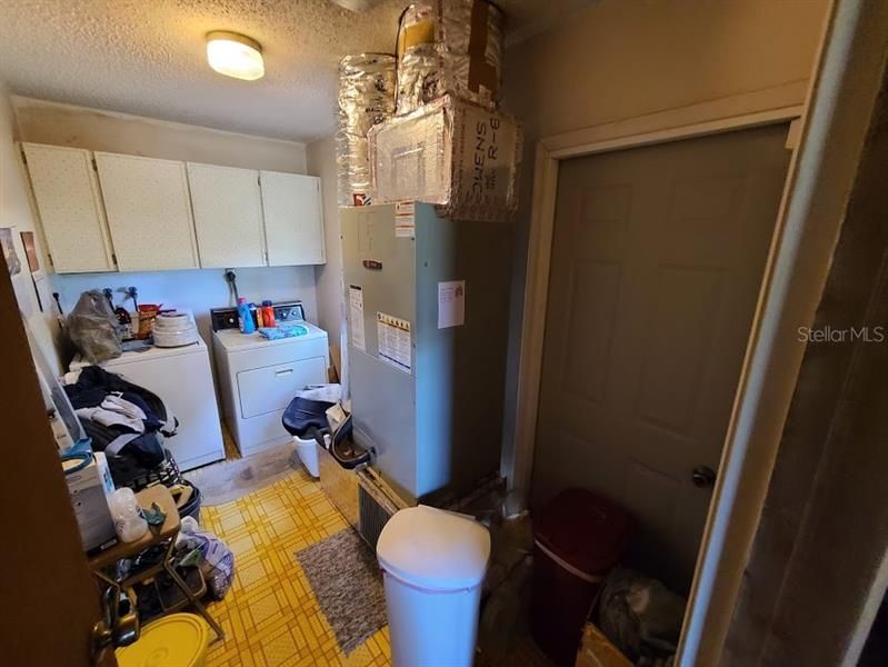 Laundry room with door to side yard
