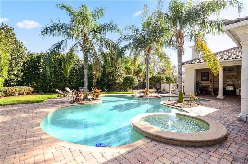 Pool and spa surrounded by an expansive paved Lanai offer lots of open outdoor space