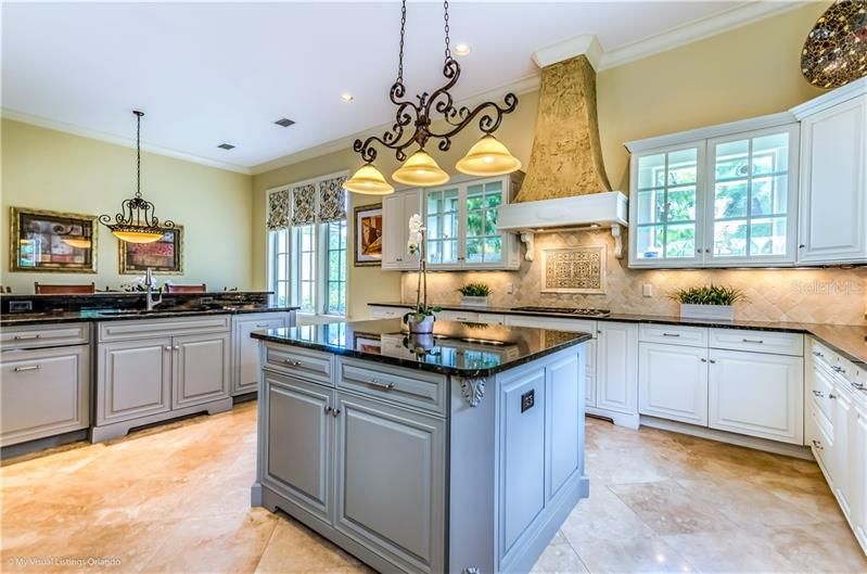 Windows behind the cabinets add light to the Kitchen