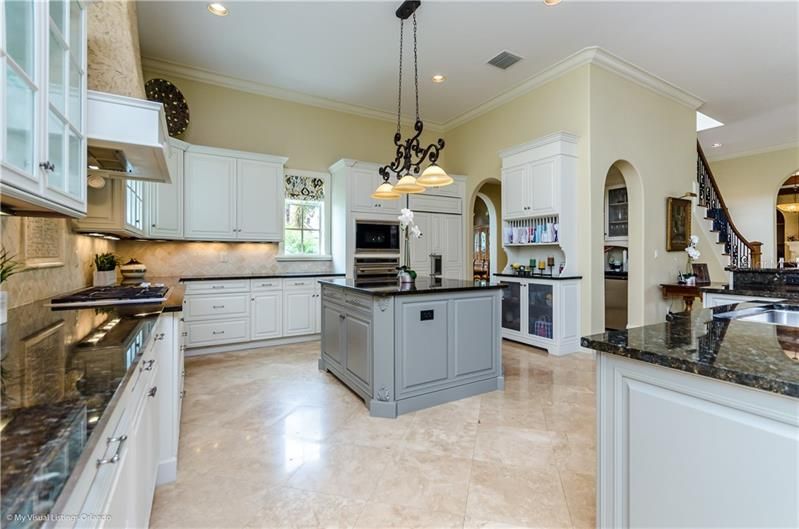 Kitchen has a butler's pantry with a beverage cooler and walk-in pantry