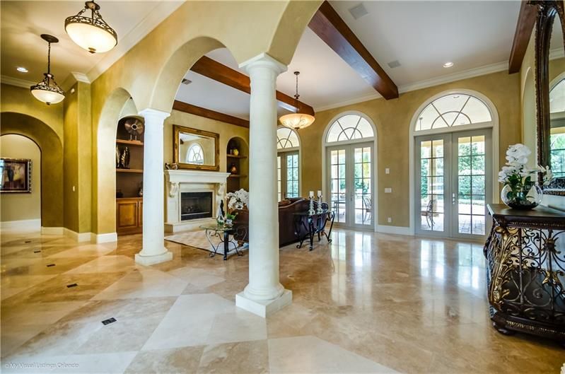 Large Living Room along the Gallery with 3-French doors leading to the outdoor entertaining areas