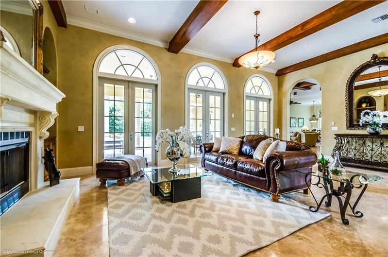 Fireplace and beamed ceilings grace the Living Room