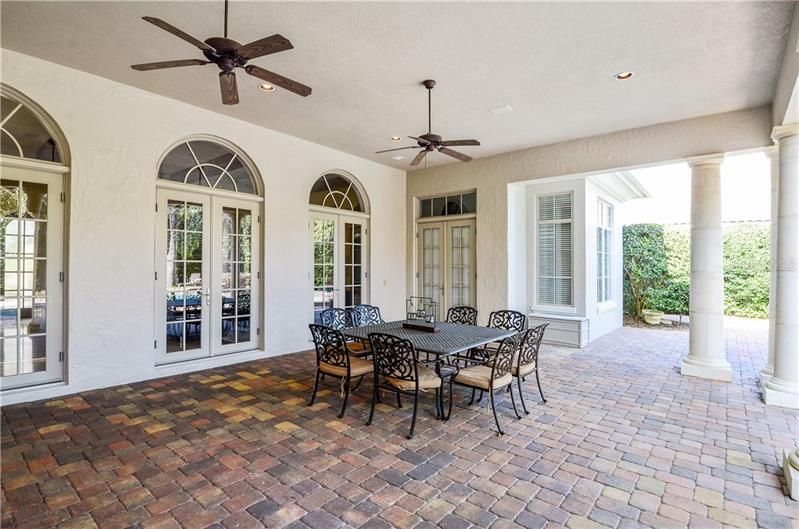 This large covered entertaining area has French doors leading from the Living Room and Master Bedroom