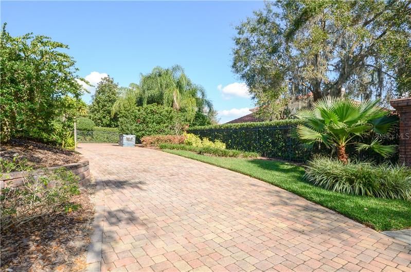 Driveway on the side of the house leads to the 3-car garage