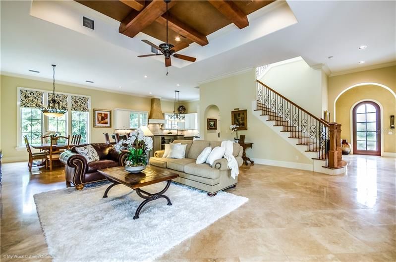 Family Room, Dinette and Kitchen with beautiful stairway to the second floor