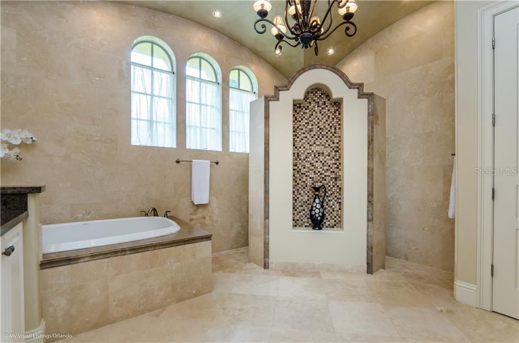 Travertine throughout the Master Bath with walk-through shower