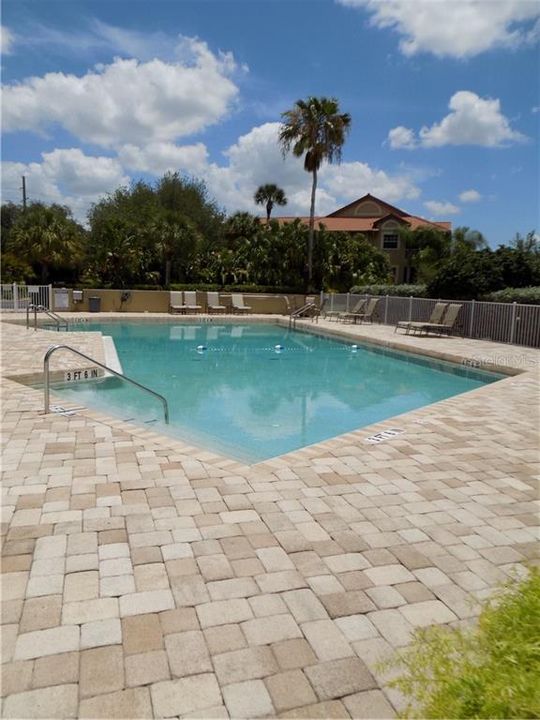 Community pool is right across the parking lot in front of the building