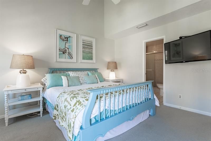 The master bedroom has high ceilings, great closet space and a private balcony.