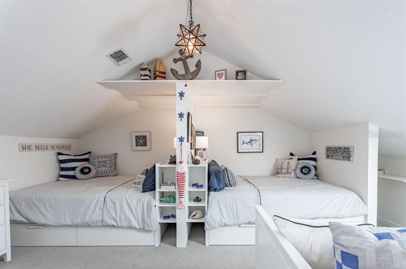 Custom-built loft offers two queen beds, drop ceiling, additional daybed with trundle - lots of sleeping options!
