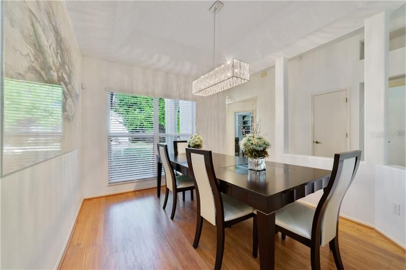 FORMAL DINING ROOM features a stunning CHANDELIER!