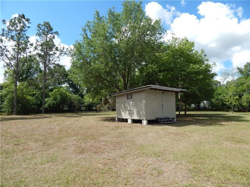 Storage shed and back yard.