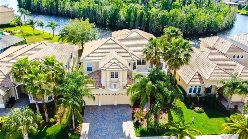 6-Bed, 4.5 Bath pool home, plus office, 3-car garage, private dock, tile roof, brick pavers and so much more!