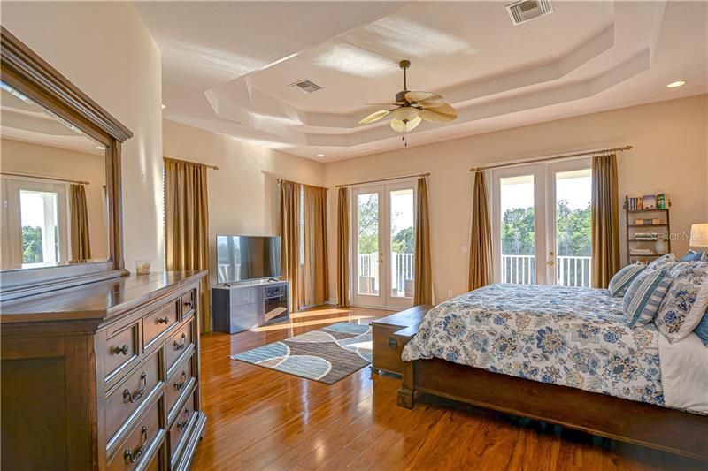 Wonderful oversized Master Suite with wood flooring, sitting area and private balcony