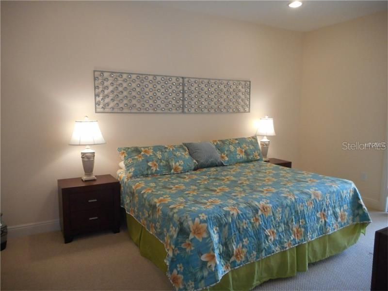 Spacious Master Bedroom with King Bed and Large Master Bath and Sliders to Patio