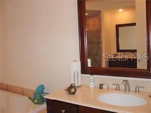 Master Bath with Dual Vanities, Separate Spa Tub and Walk In glass enclosed shower.