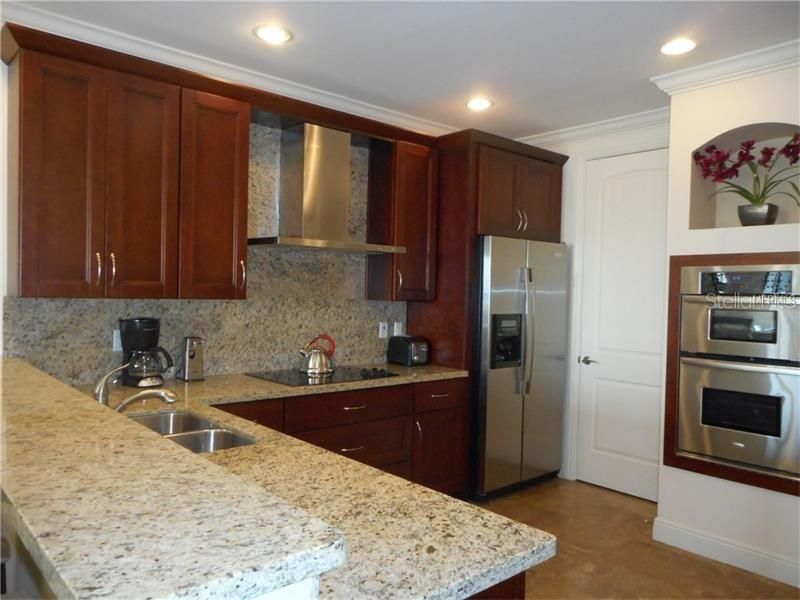 Gourmet Kitchen with view of Laundry Room