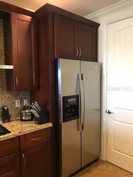 Refrigerator and door to in-suite laundry room