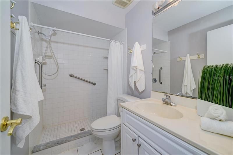 Hall bathroom with updated fixtures, tile & shower~